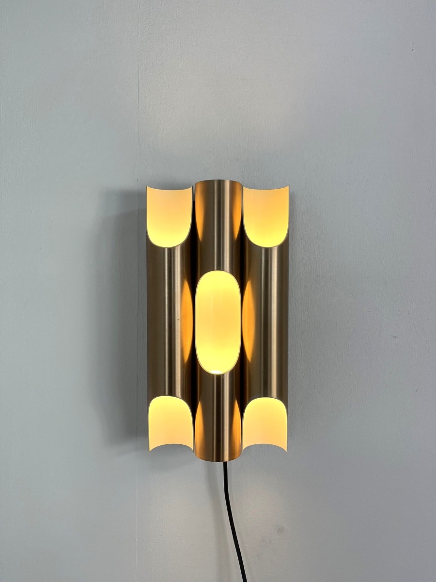 Gold colored aluminum Fuga wall lamp by Majja Liisa Komulainen for Raak, 1964