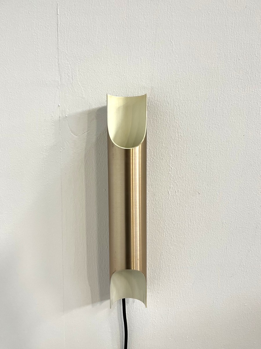 Gold colored aluminum Fuga wall lamp by Majja Liisa Komulainen for Raak, 1964