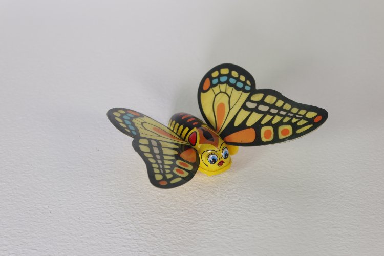 Vintage Japanese wind-up tin and plastic flapping butterfly by Yone